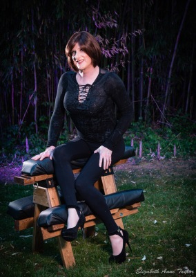 Image of Allison in front of purple bamboo on bench