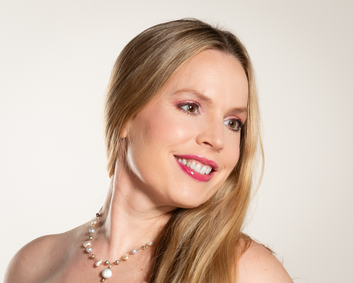 Elizabeth Taylor glows from her total makeover and photoshoot. She offers MtF makeover services at her Takoma Park, Maryland crossdressing studio.